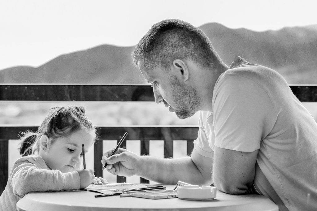 Father coloring with daughter