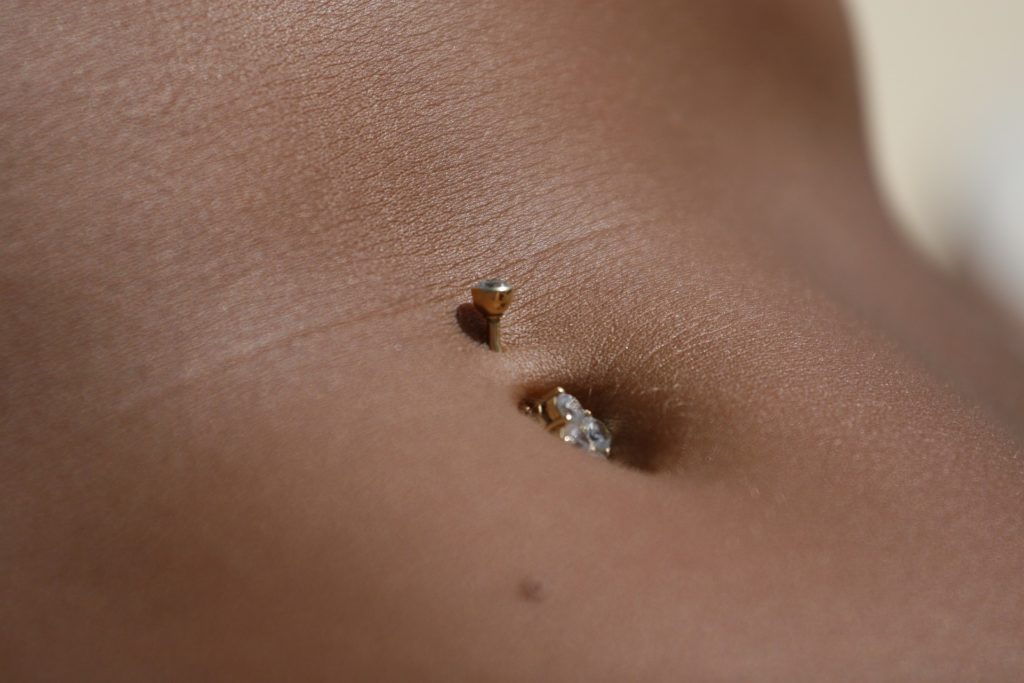 Should I Let My Daughter Get A Belly Button Piercing is a common question. 